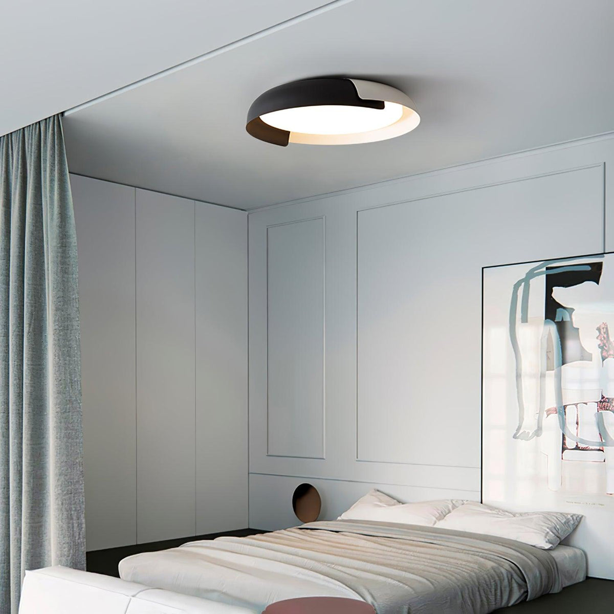 A black and dark wood Clérachic ceiling light lit above a grey bedroom, with a green curtain and a low white bed.
