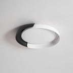A white and black Clérachic ceiling light, shown unlit from below on a light grey backdrop.