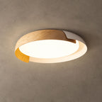 A light wood and white Clérachic ceiling light lit with a warm glow, against a textured grey-brown ceiling.