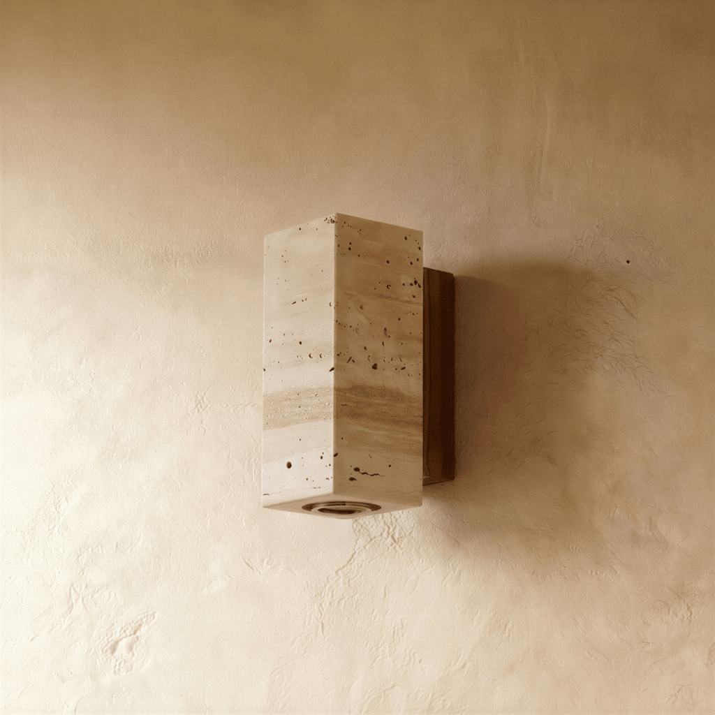 A closer angle on the Clérachic wall lamp's rectangular stone block and walnut mounting base.