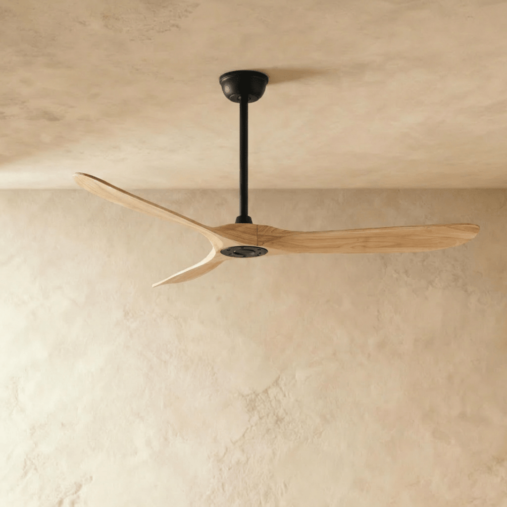 Clérachic ceiling fan in natural wood with a black body, three blades and a slim downrod, seen in the studio