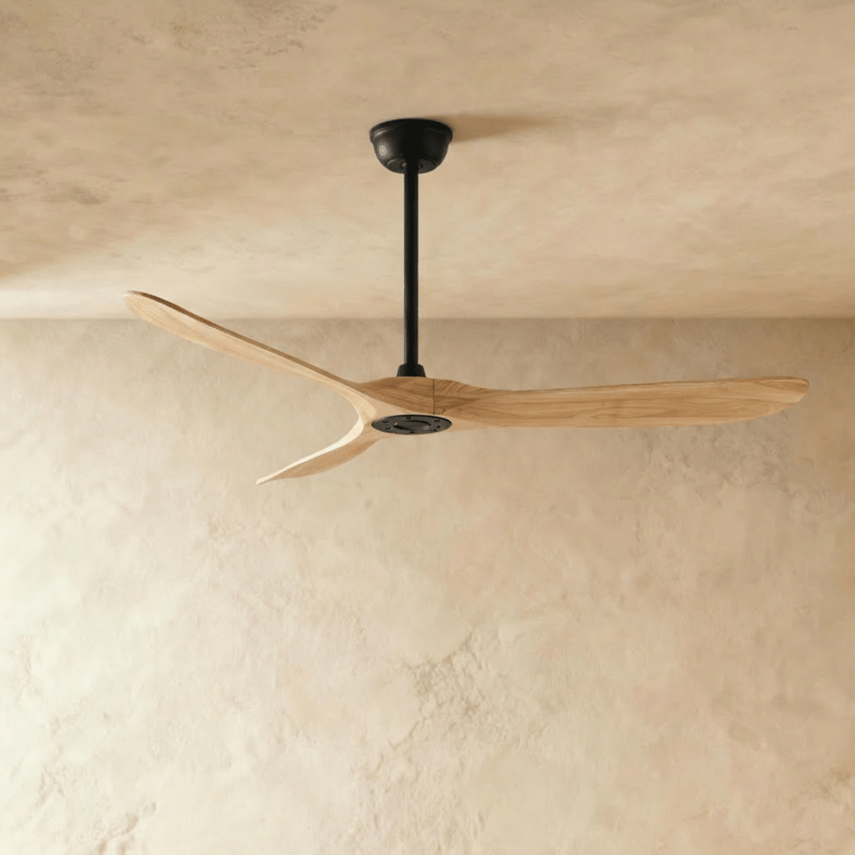 Clérachic ceiling fan in natural wood with a black body, three blades and a slim downrod, seen in the studio