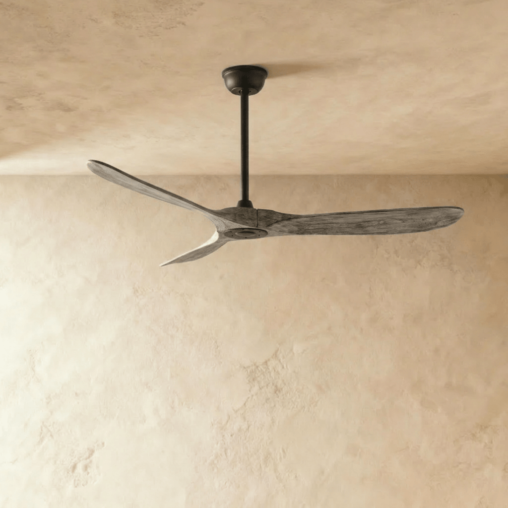 Clérachic three-blade ceiling fan with weathered grey wood blades and a black downrod and canopy, photographed in the studio