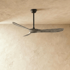 Clérachic three-blade ceiling fan with weathered grey wood blades and a black downrod and canopy, photographed in the studio