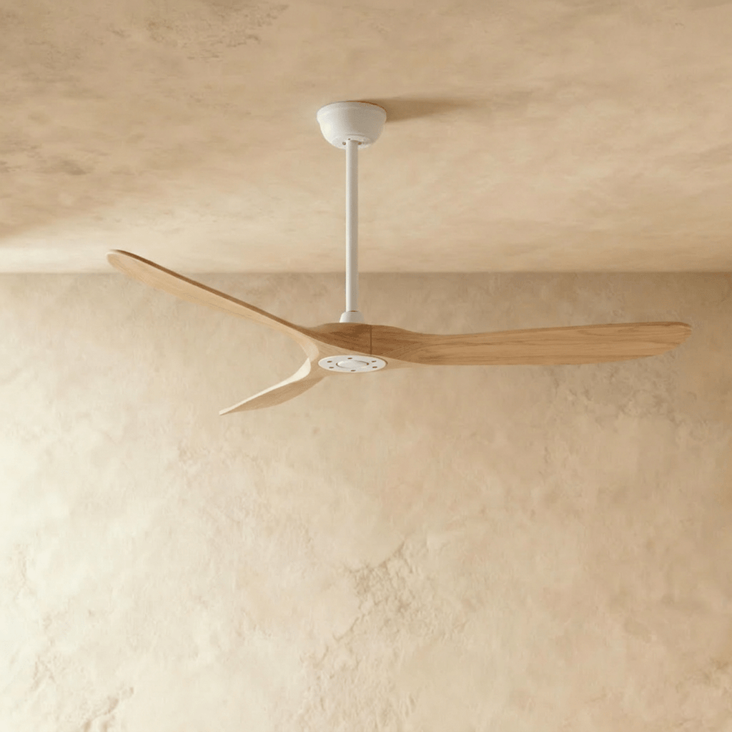 Clérachic three-blade ceiling fan with natural wood blades and a white downrod, canopy and hub, shown in the studio