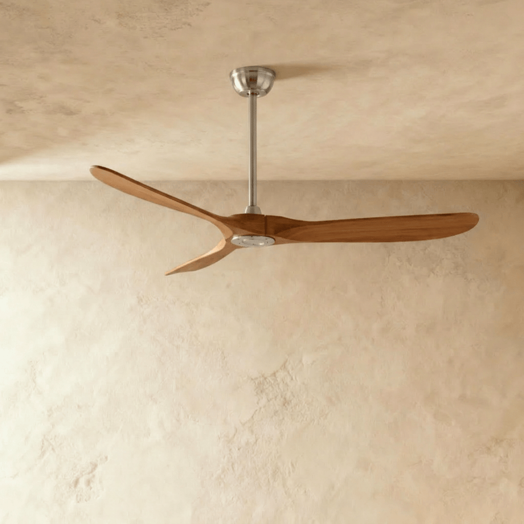 Clérachic three-blade ceiling fan with warm dark wood blades and a brushed nickel downrod and canopy, in the studio