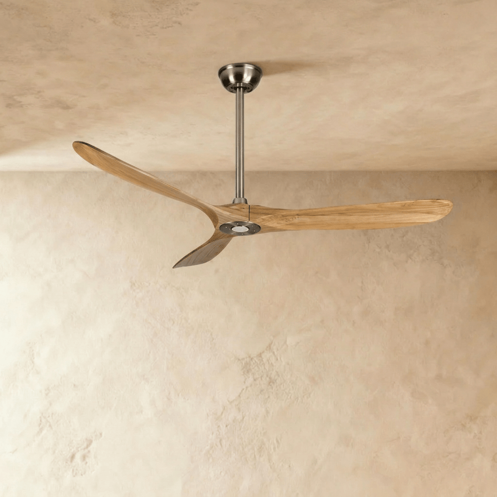 Clérachic ceiling fan with natural wood blades and a brushed nickel downrod, canopy and hub, photographed in the studio