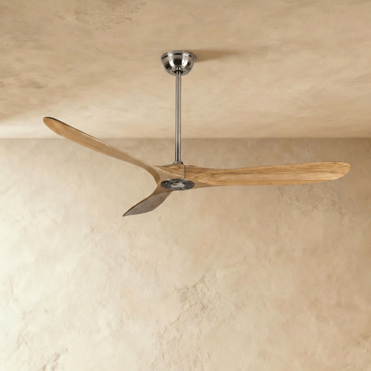 Clérachic three-blade ceiling fan in natural wood and nickel, with long curved blades on a slim downrod, in the studio