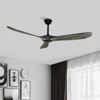 Clérachic three-blade ceiling fan with grey wood blades and a black downrod, hung in a bedroom with framed prints and curtains