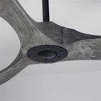 Clérachic ceiling fan close up of the grey wood-grain blades meeting at a black hub plate with six screws