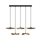Five Clérachic leaf pendants in walnut colour hung at two levels from a long black canopy, on white.