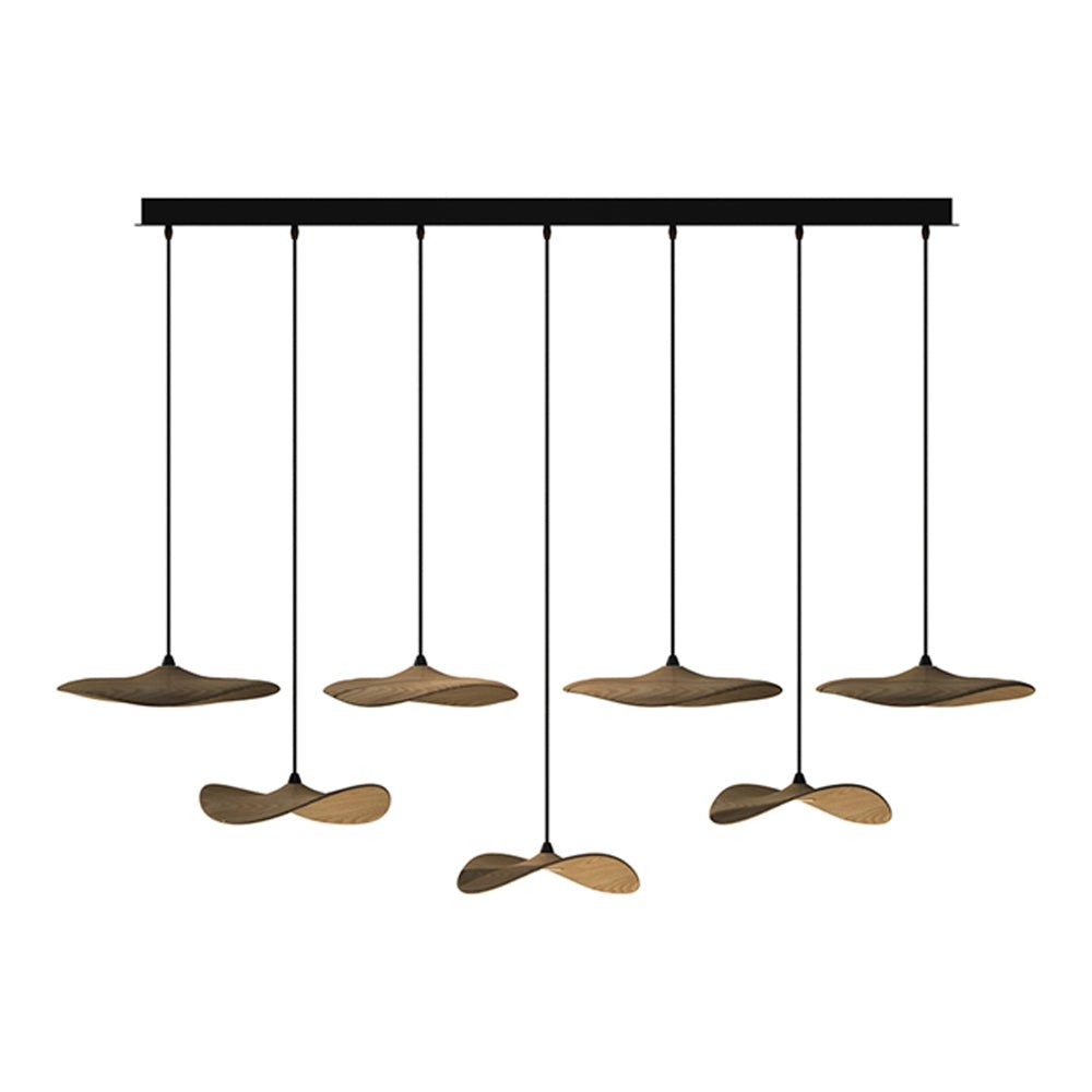 Seven Clérachic leaf pendants in walnut colour on a long black bar canopy, hanging at alternating levels.