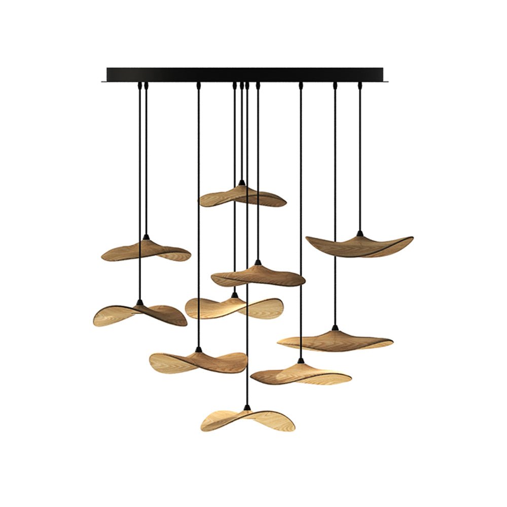 Dense cluster of light wood Clérachic leaf pendants from a wide black canopy, in several layers, on white.