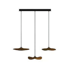 Three Clérachic walnut-colour leaf pendants hung at two levels from a black bar canopy, on white.