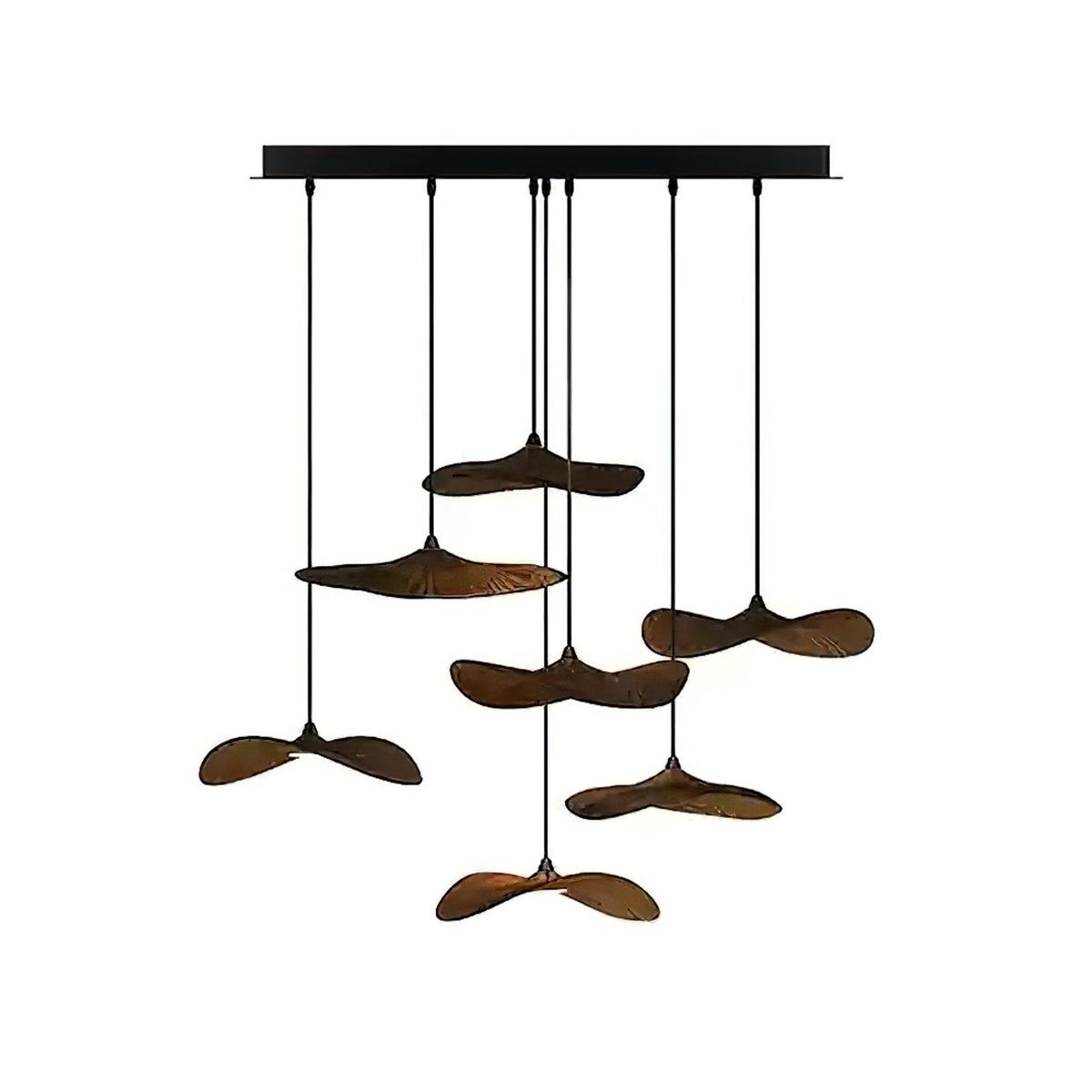 Eight Clérachic leaf pendants in dark walnut colour hung at varied heights from a black canopy, on white.