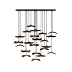 Very full cluster of dark walnut-colour Clérachic leaf pendants of different sizes, on a white background.