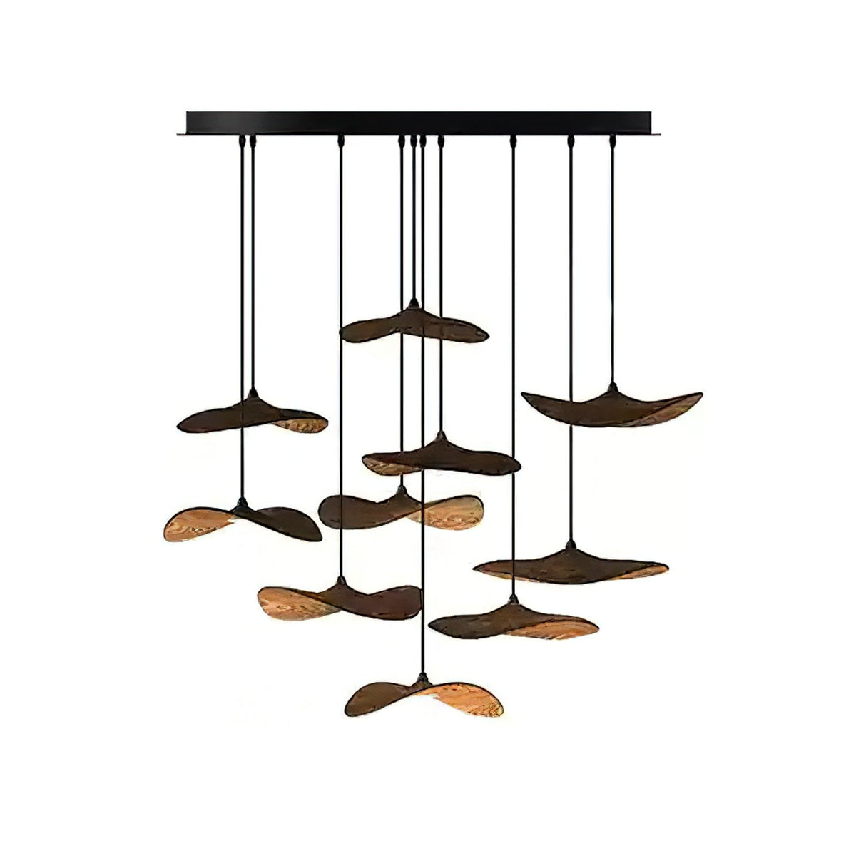 Cluster of ten Clérachic leaf pendants in walnut colour hung from a black bar canopy, with a warm glow below.