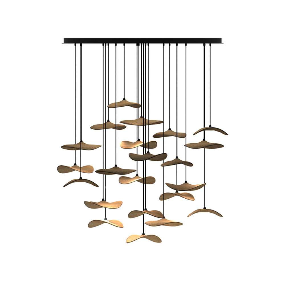 Cluster of light wood Clérachic leaf pendants on a long black canopy, hung in many layers, on a white background.