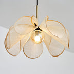 Looking up into the shade of this Clérachic pendant, where the woven petals curl open around a round bulb.