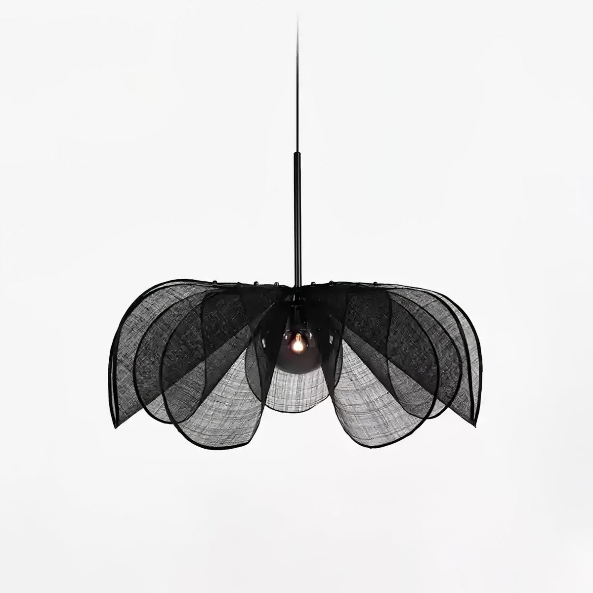Black woven version of this Clérachic pendant on a light grey backdrop, its layered petals fanning around a dark bulb.