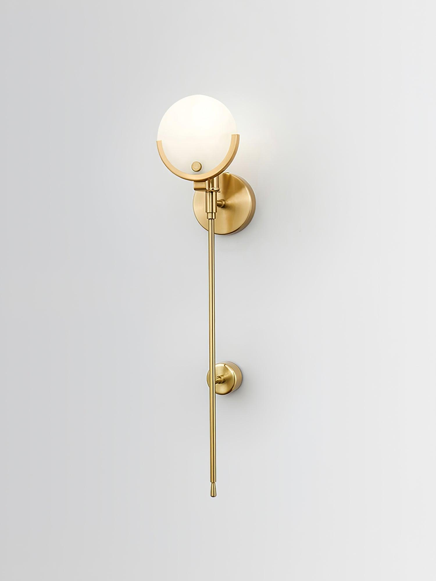 The Clérachic sconce shown full length on white, brass crescent above a tapering stem with a mid-stem collar.