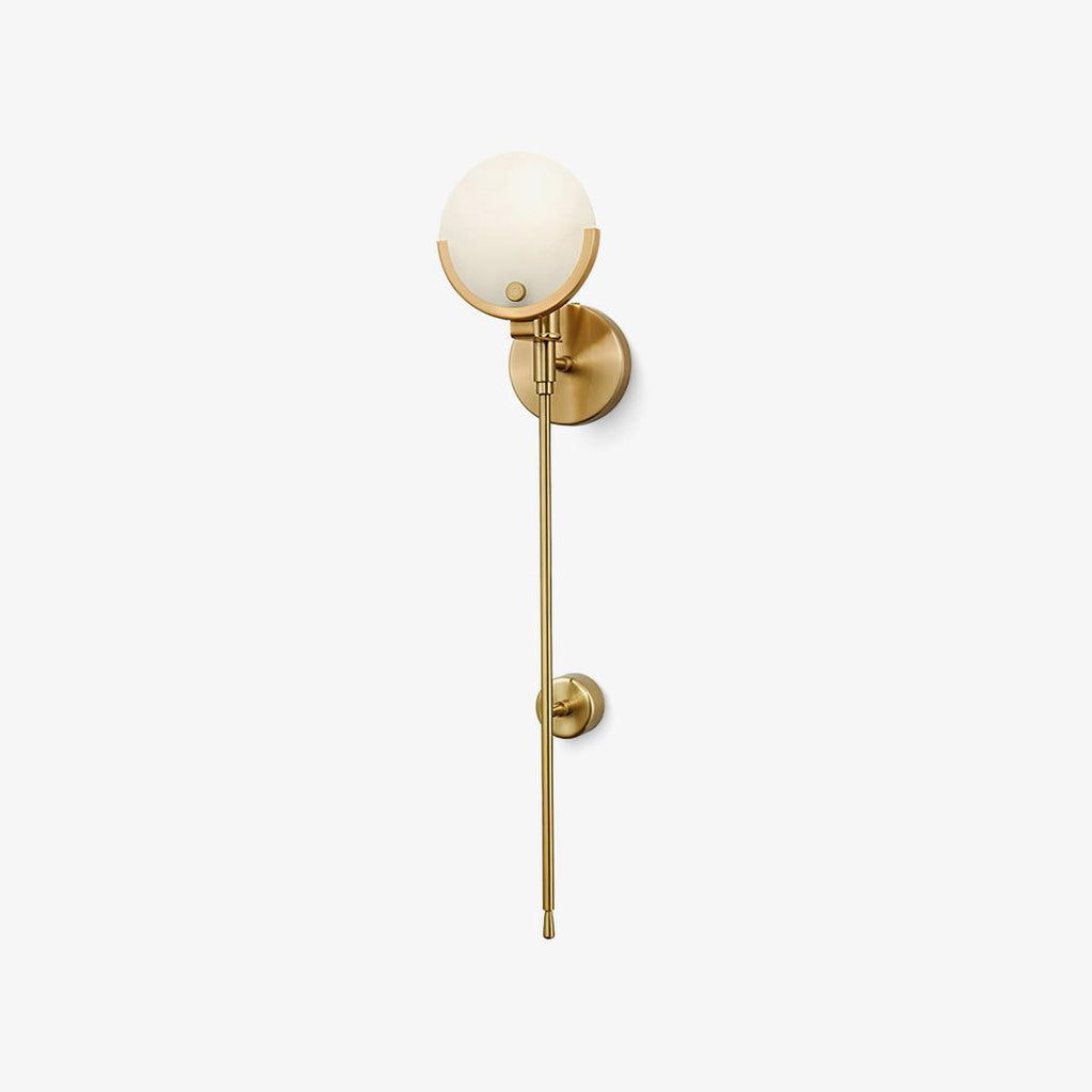 The Clérachic sconce photographed full length, showing the globe shade and the long slender brass stem below.