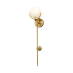 Clérachic wall light on a clean white ground, the whole fixture from crescent-held globe to slim brass tail.