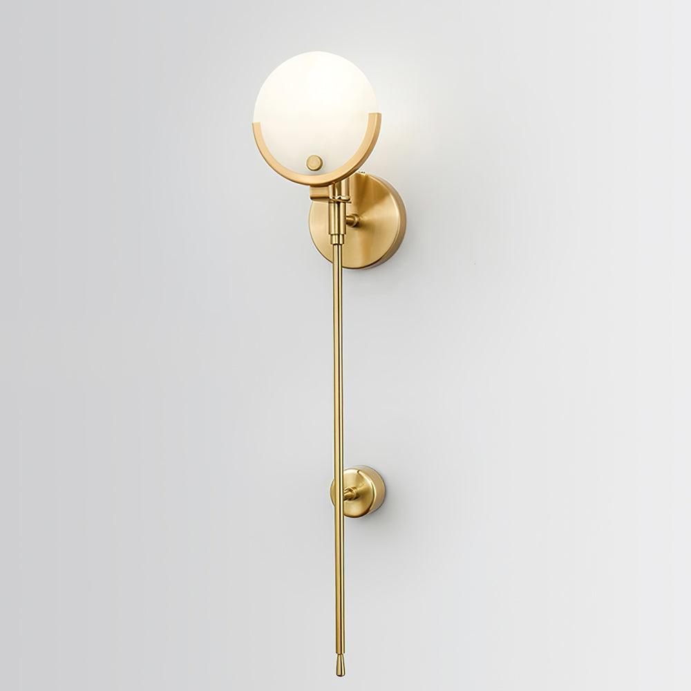 Clérachic sconce shown closer on the same pale wall, the brushed brass finish reading warm against the white.