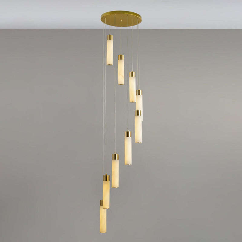 Clérachic Zeal chandelier shown at nine drops, the alabaster tubes turning in a slow helix beneath a brass ceiling plate.