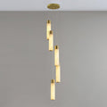 The Clérachic Zeal chandelier viewed square on, brass-collared alabaster tubes falling at alternating heights.