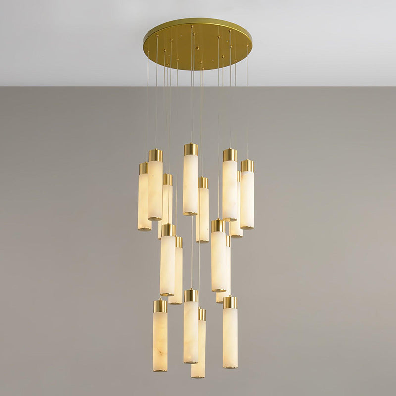 Clérachic Zeal chandelier in its widest cluster, eighteen alabaster drops arranged in tiered rows under a brass plate.