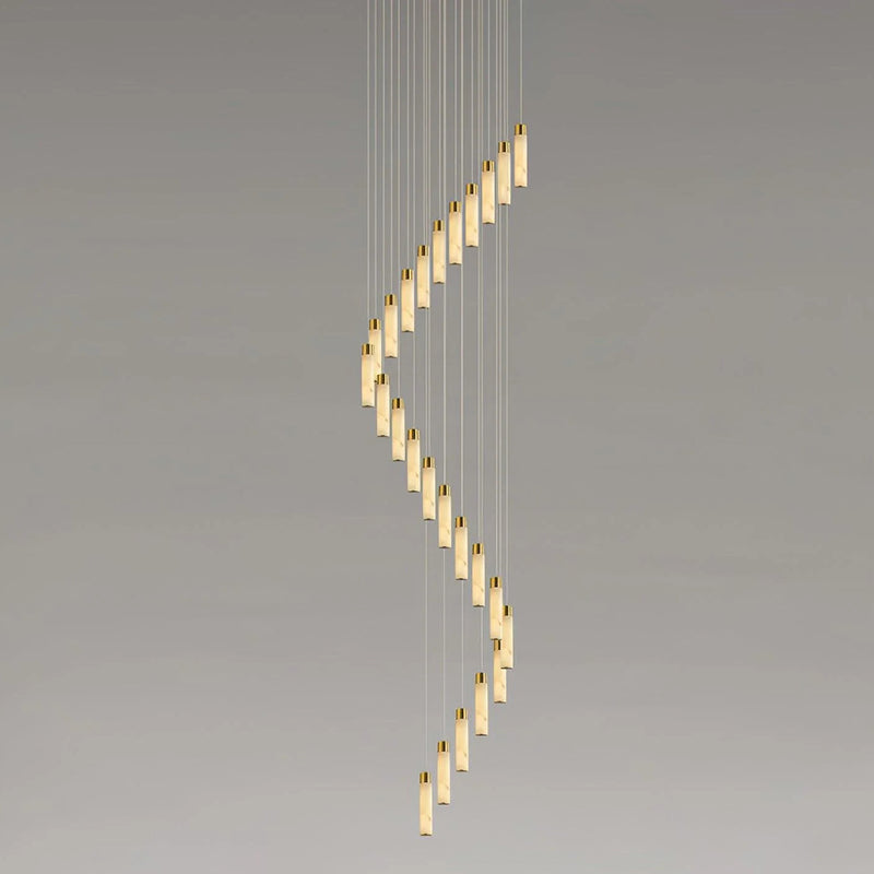 Clérachic Zeal cascade shot against a plain wall so the spacing between each alabaster drop is clear.
