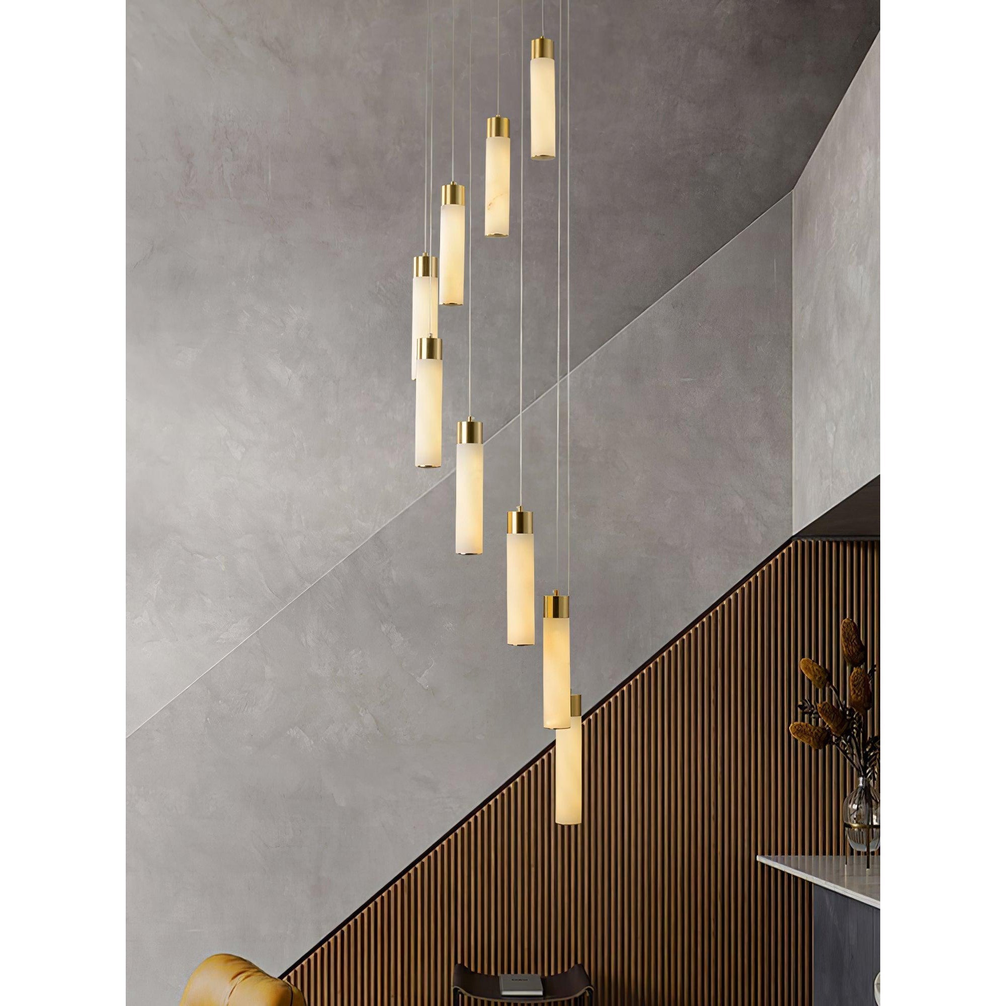 The Clérachic Zeal cascade filling a stairwell wall of grey plaster and slatted timber.