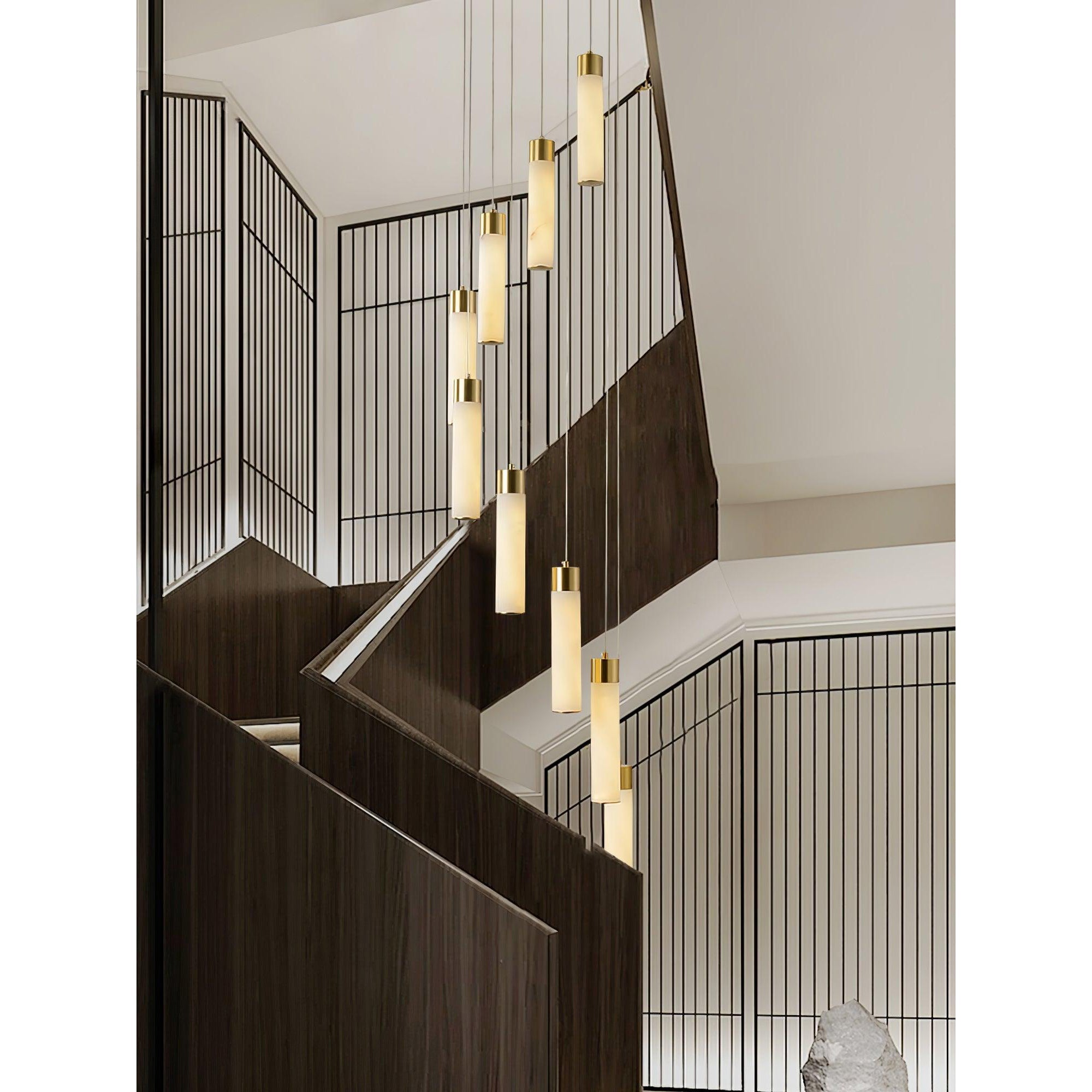 Clérachic Zeal cascade descending a dark timber stairwell framed by slim black screens.
