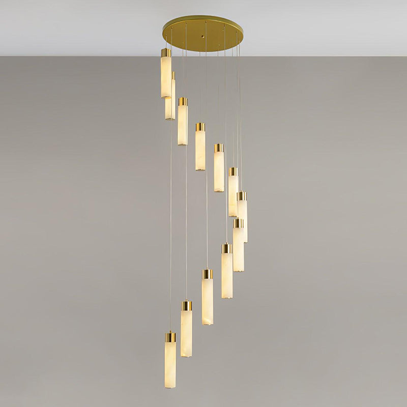 The Clérachic Zeal chandelier from a low angle, brass canopy overhead and the alabaster drops receding into the spiral.