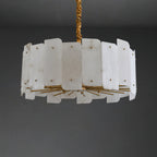 Wide ten-light Clérachic Zoe alabaster chandelier unlit on a dark backdrop, its brass rods fanning out beneath two tiers of stone.