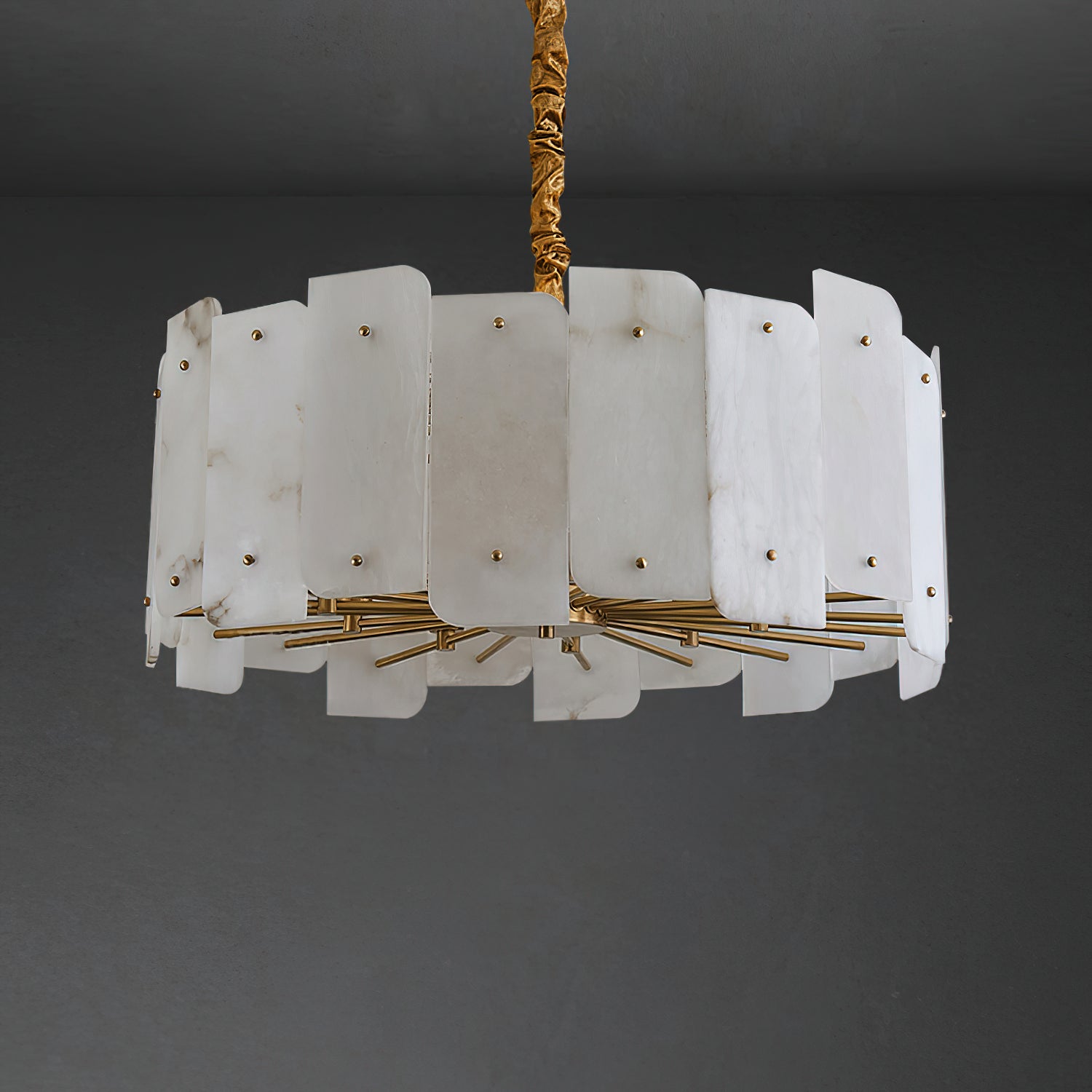 Wide ten-light Clérachic Zoe alabaster chandelier unlit on a dark backdrop, its brass rods fanning out beneath two tiers of stone.