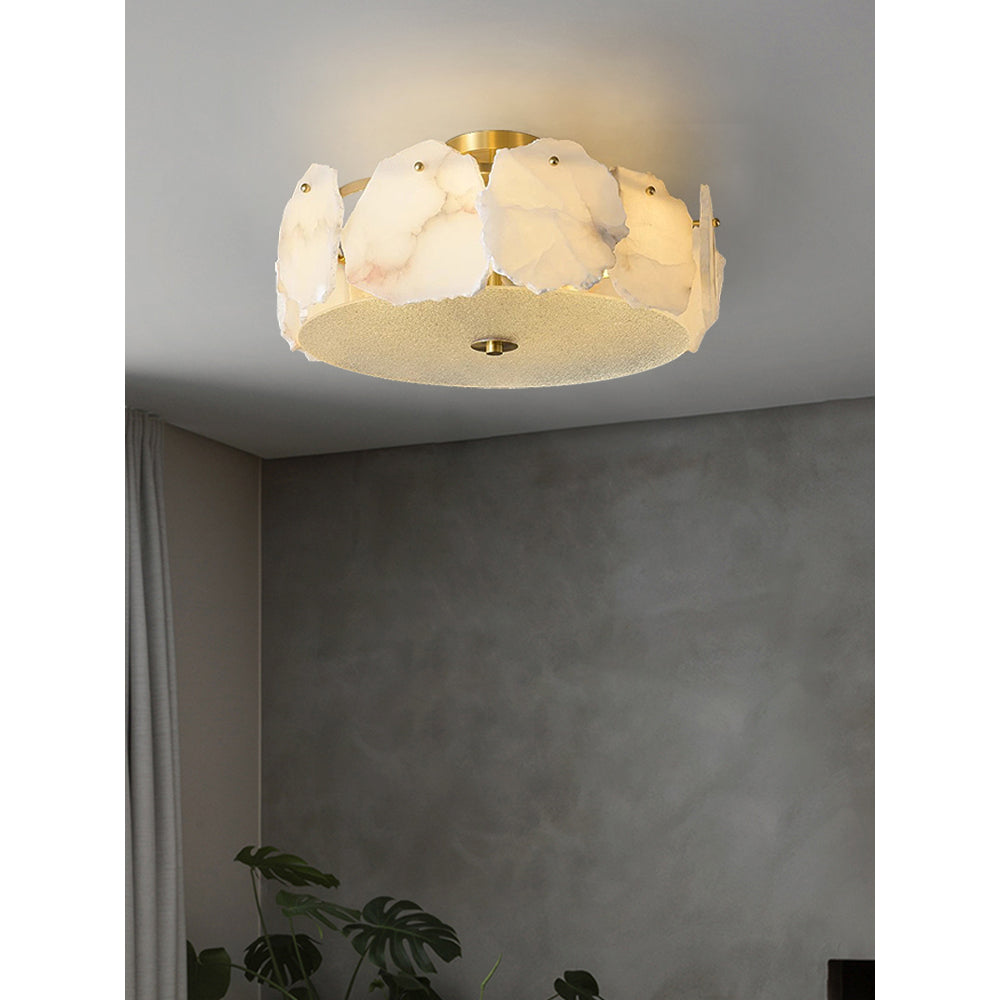 Clérachic flush mount on a plain grey ceiling, a curtain and a leafy plant just below in a quiet corner.