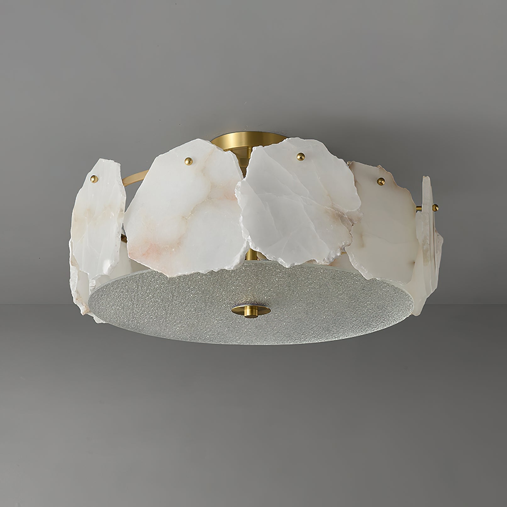 Clérachic ceiling light shown side-on, the alabaster slabs standing proud of the frosted glass base disc.