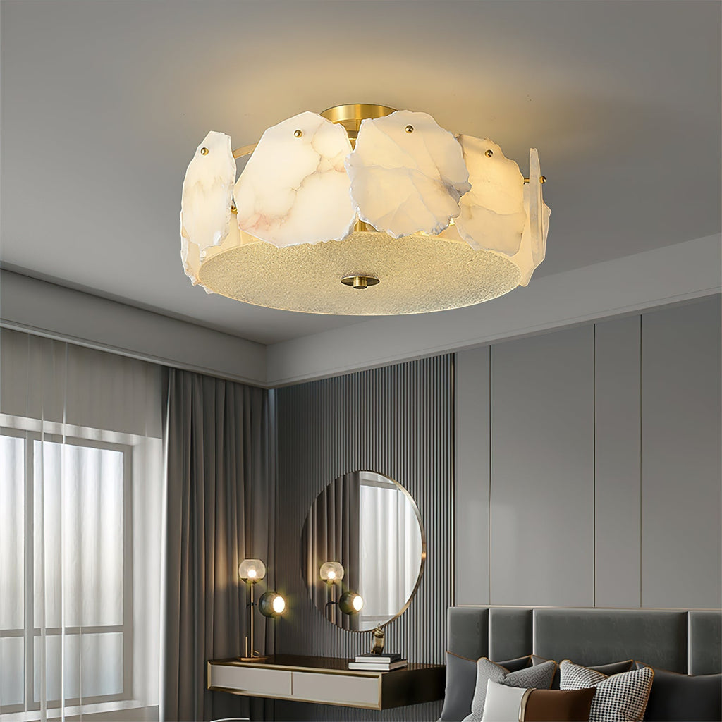 Clérachic flush mount above a bedroom vanity with a round mirror and sheer curtains at the window.