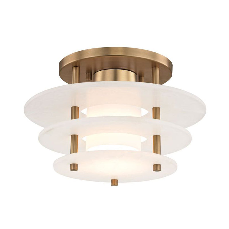 Clérachic Zovena semi-flush ceiling light seen from below at an angle, its three alabaster discs stepping out beneath a round brass canopy.