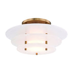 Close view of the Clérachic Zovena ceiling light showing the brass standoffs pinning the alabaster discs apart and the veining in the stone.