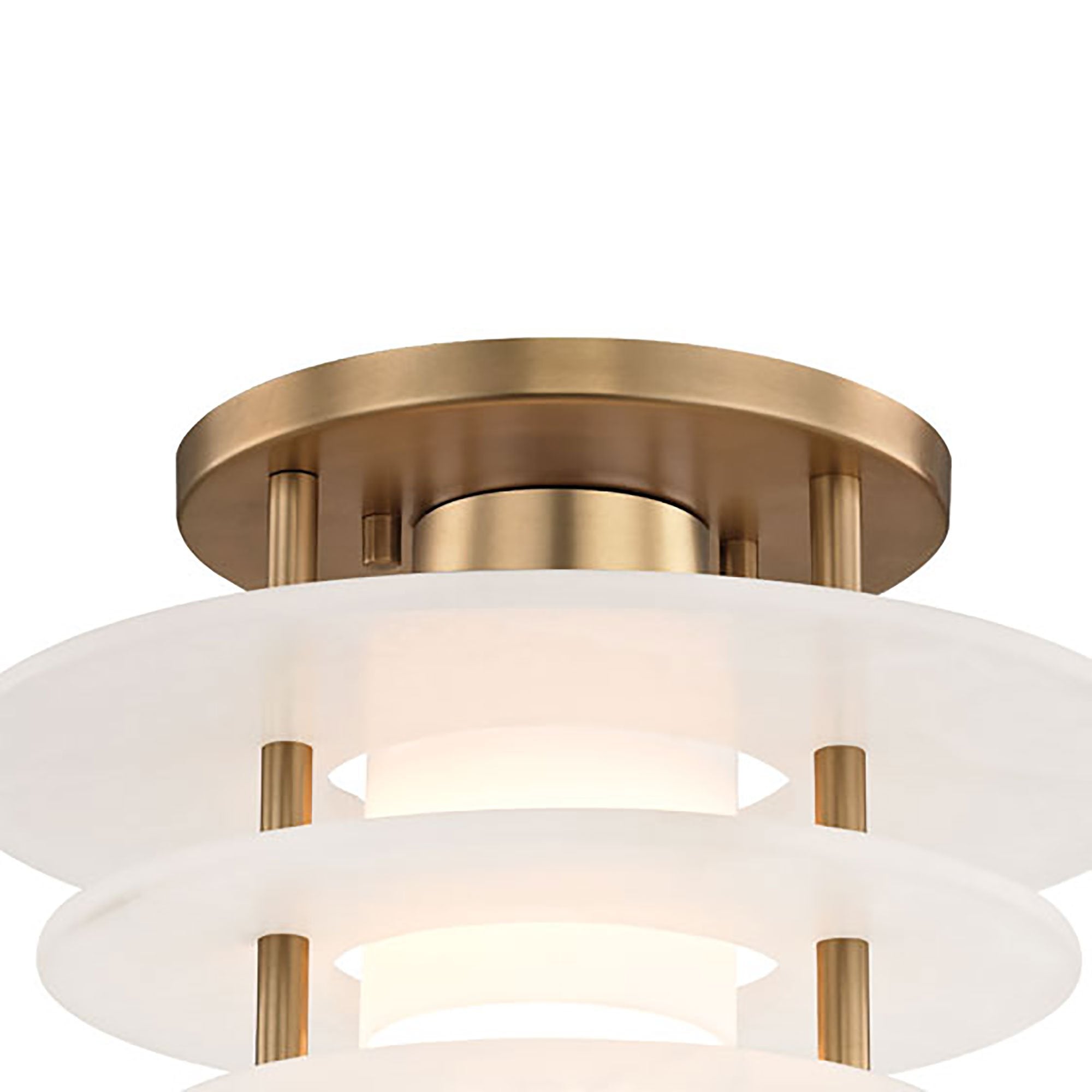 Detail of the round brass ceiling plate on the Clérachic Zovena semi-flush light, with standoffs dropping to the top alabaster disc.