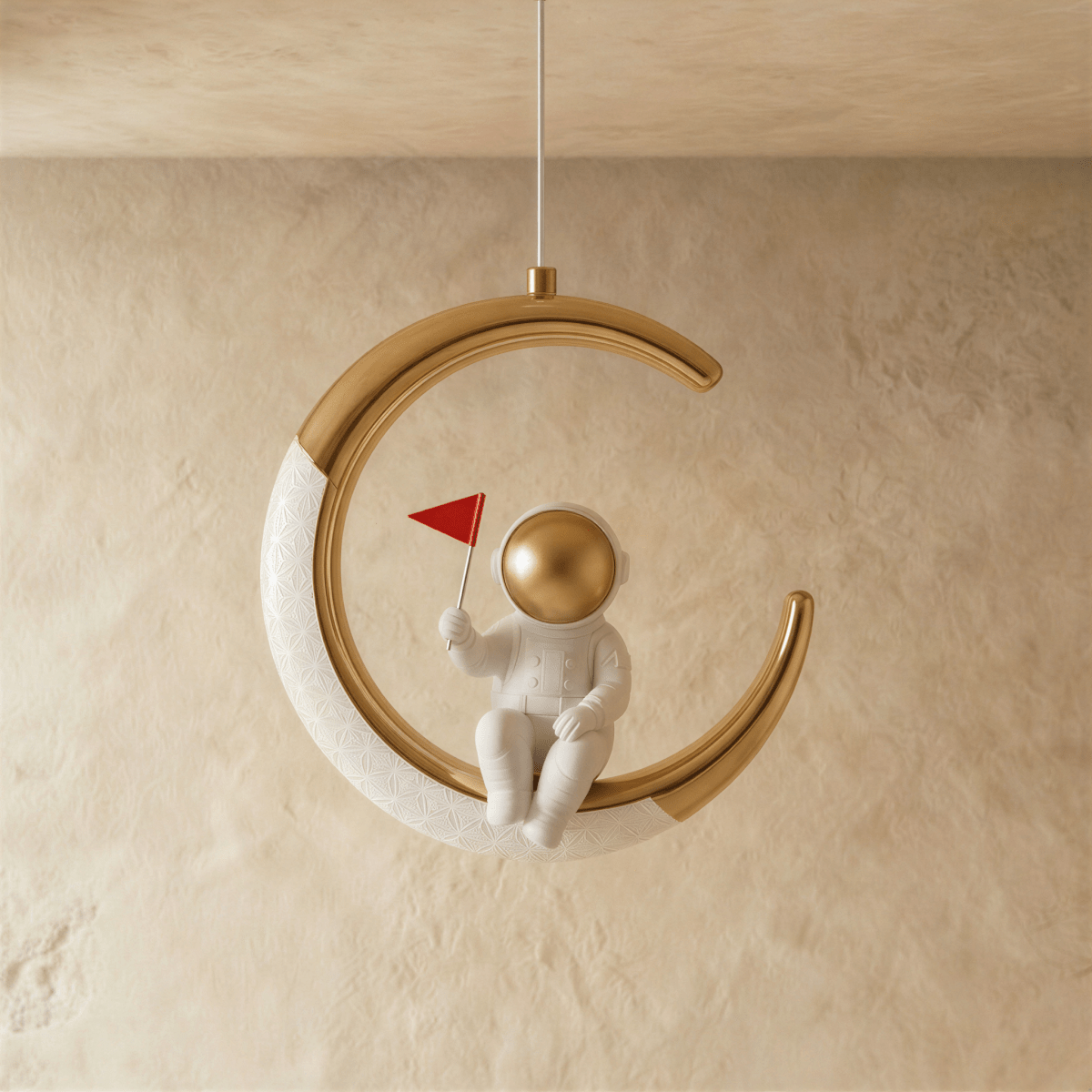 Clérachic moon pendant light in gold, the astronaut figure and glowing edge shown from another angle.