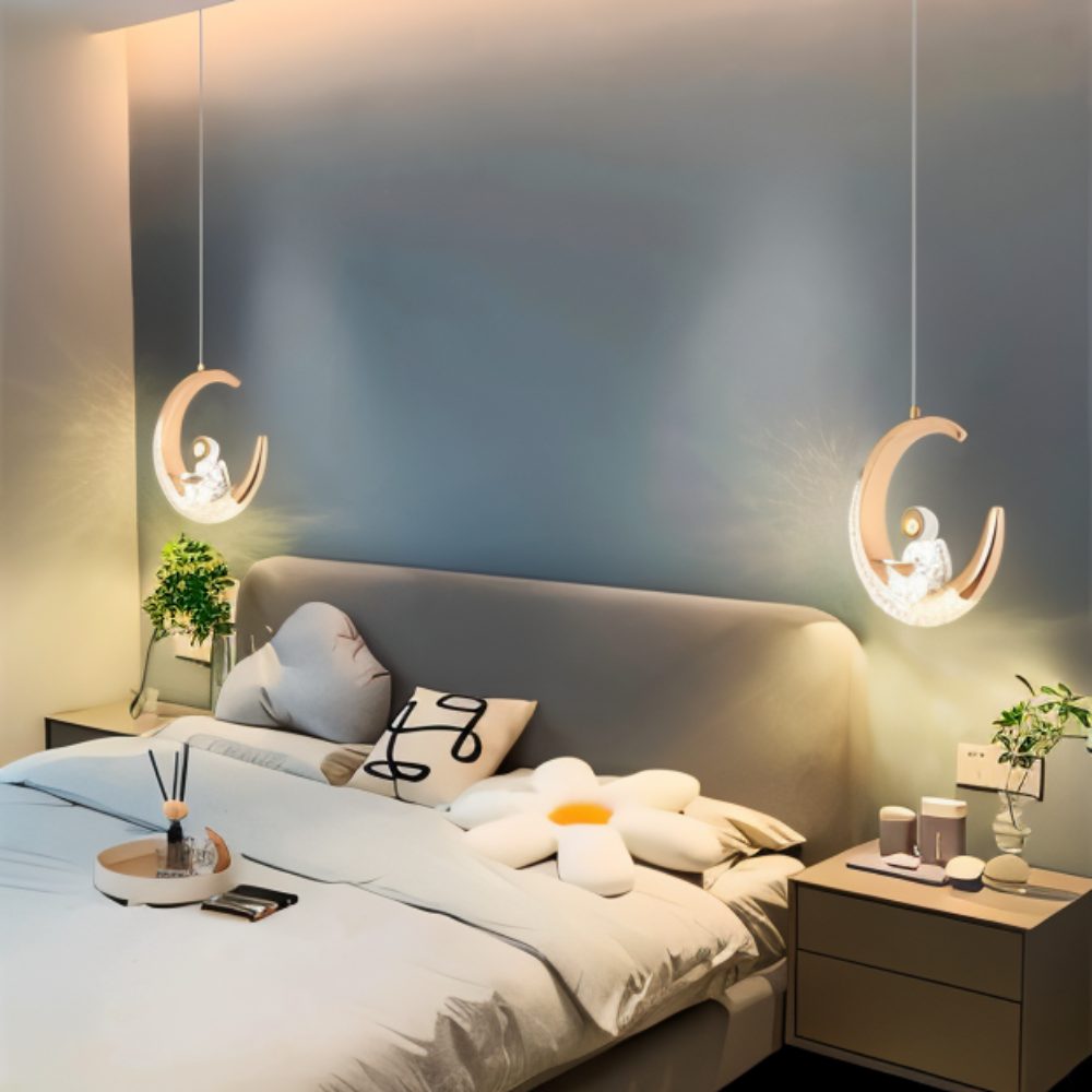 This Clérachic moon pendant lights glowing above matching nightstands on either side of a bed.