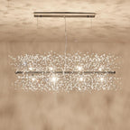 Product shot of a chrome-finish rectangular bar pendant on a warm beige backdrop, a different Clérachic fixture from this chandelier.