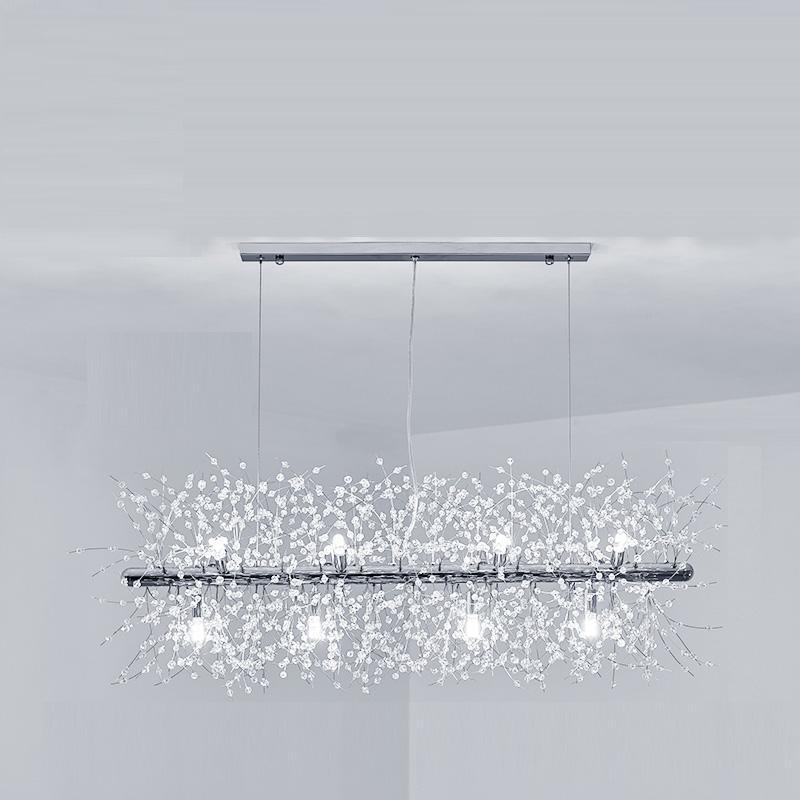 Product shot of a chrome-finish rectangular bar pendant on three cables, a different Clérachic fixture from this chandelier.