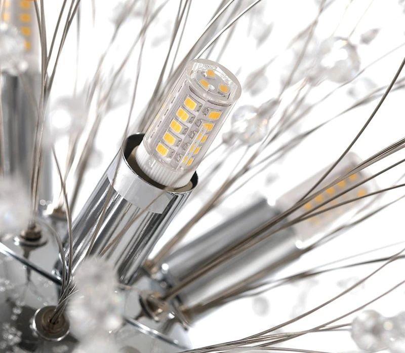 Close-up of a single LED bulb among the wire branches of this Clérachic chandelier, its filament array visible.
