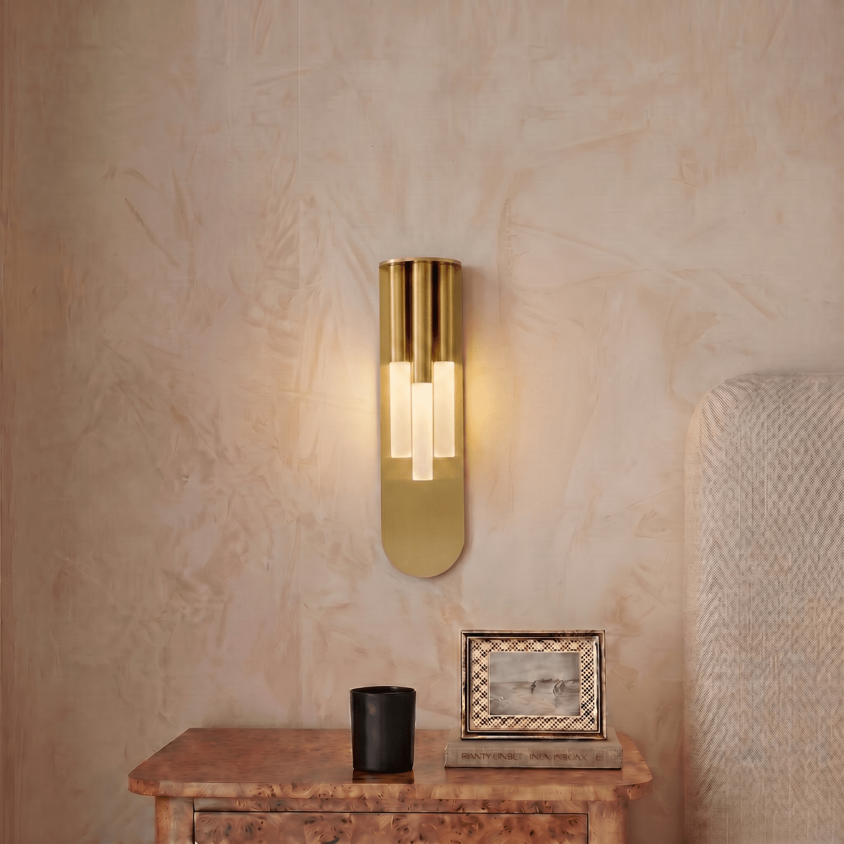 Clérachic wall light shown in gold and black together