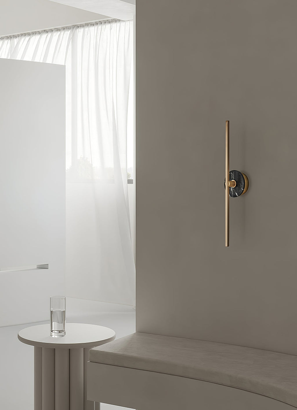 Clérachic wall light mounted in a bright nook beside a sheer curtain, a round side table holding a glass of water below.